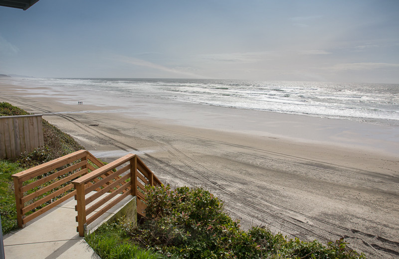 Steps to beach at Beachfront Vacation Rentals.