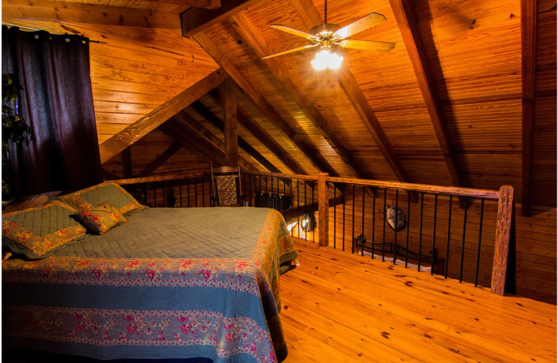 Cabin bedroom at Whispering Hills Cabins.