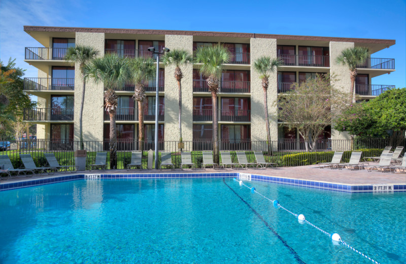 Outdoor pool and view of property at Rosen Inn.