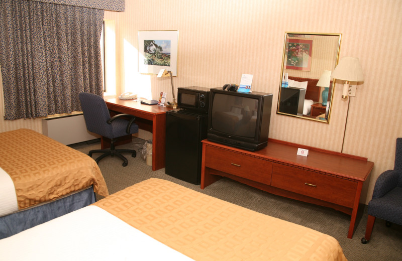 Guest room at Baymont InnSuites Detroit Roseville.