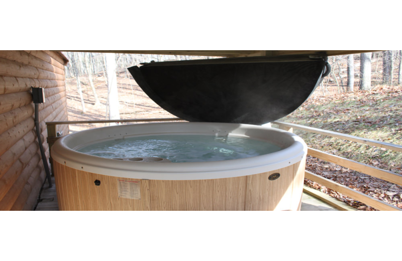 Cabin hot tub at Hocking Hills Backwoods Retreat.