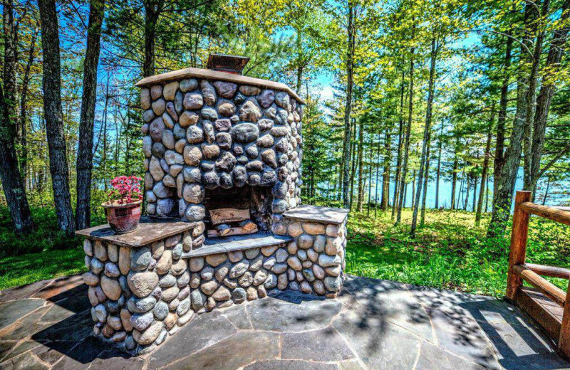 Rental patio fireplace at Bayfield Best House Rentals.