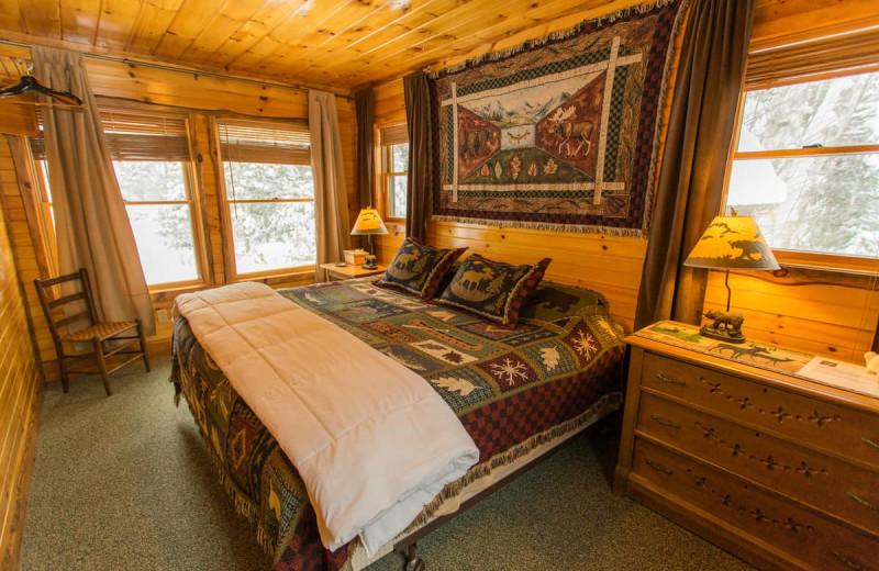 Cabin bedroom at Lake Clear Lodge & Retreat.