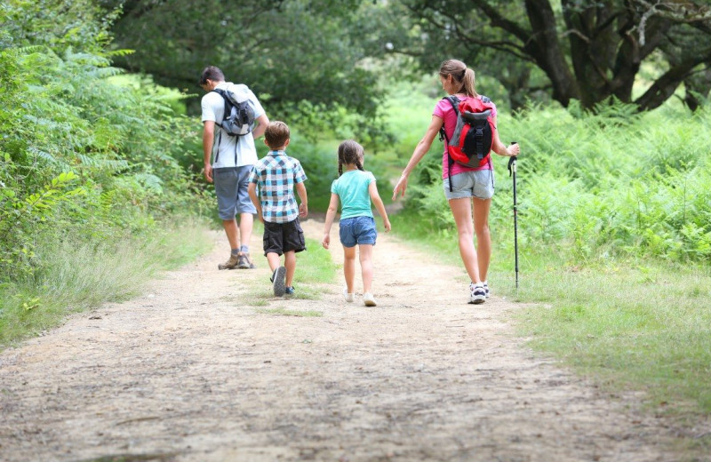 Family hiking at Cottage Place on Squam Lake.