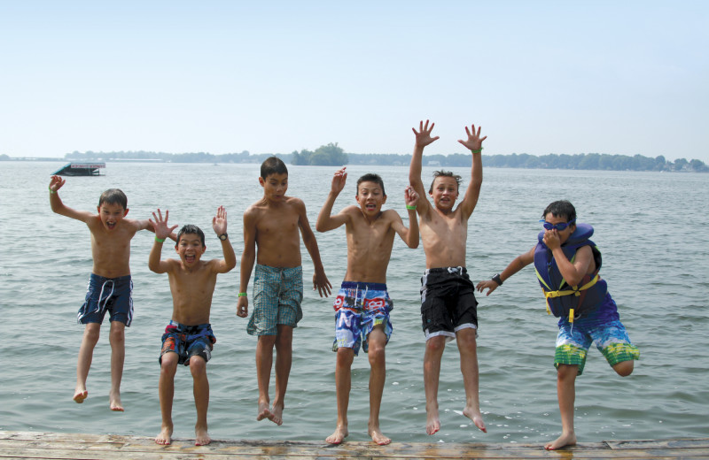 Kids jumping off the ski dock at Fern Resort