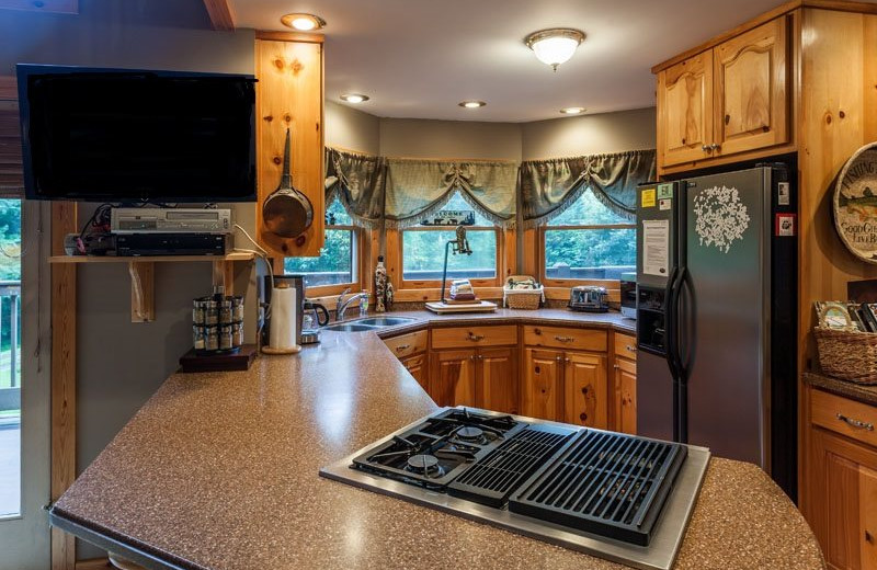 Cabin kitchen at Mountain Oasis Cabin Rentals.