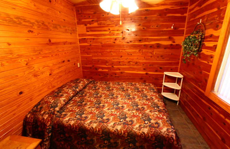 Cozy bedroom at Ozark Cabins.