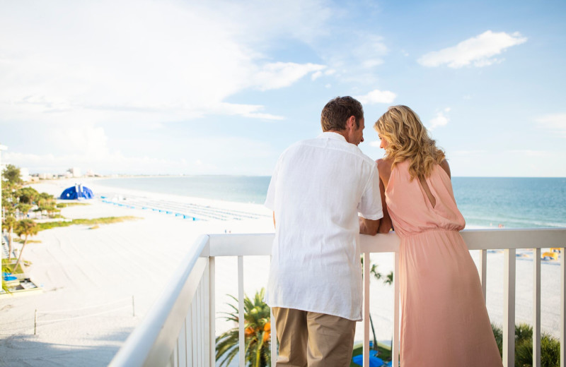 Couple on balcony at TradeWinds Island Grand.