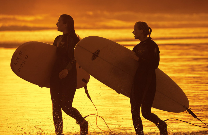 Surfing on the beach at Cox Bay Beach Resort.