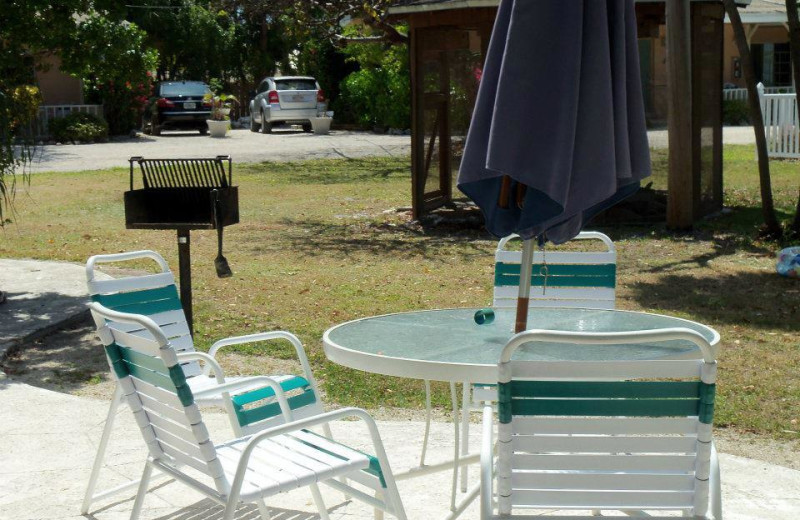 Lawn chairs with grill at Coral Bay Resort. 