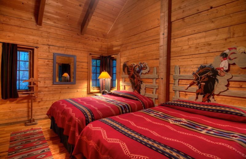 Cabin bedroom at The Home Ranch.