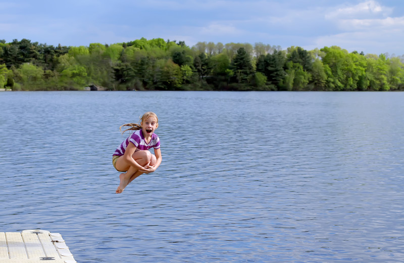 Jumping in lake at Red School Resort.