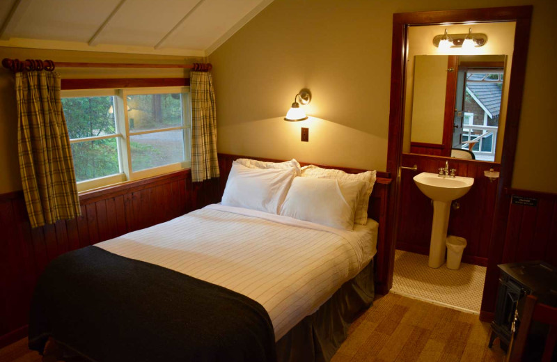 Cabin bedroom at Johnston Canyon Lodge & Bungalows.