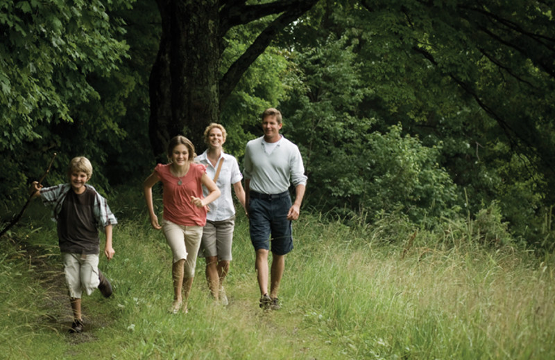 Family hiking at The Inns at Equinox.