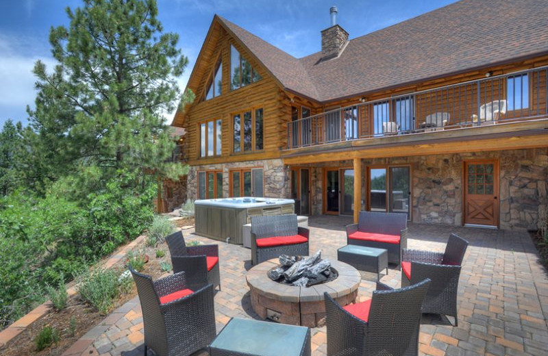 Rental patio and hot tub at Hill Country Lake House.