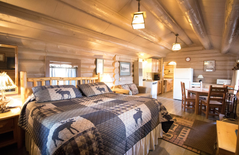 Cabin bedroom at Pine River Lodge.