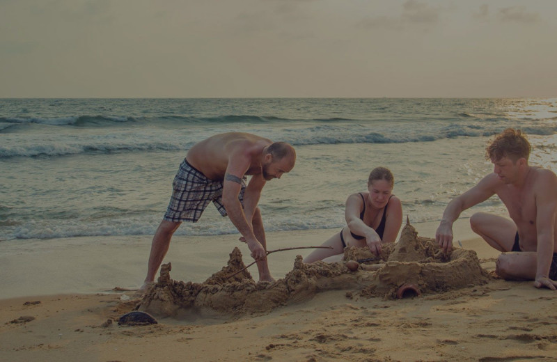 Family on beach at Port A Escapes.