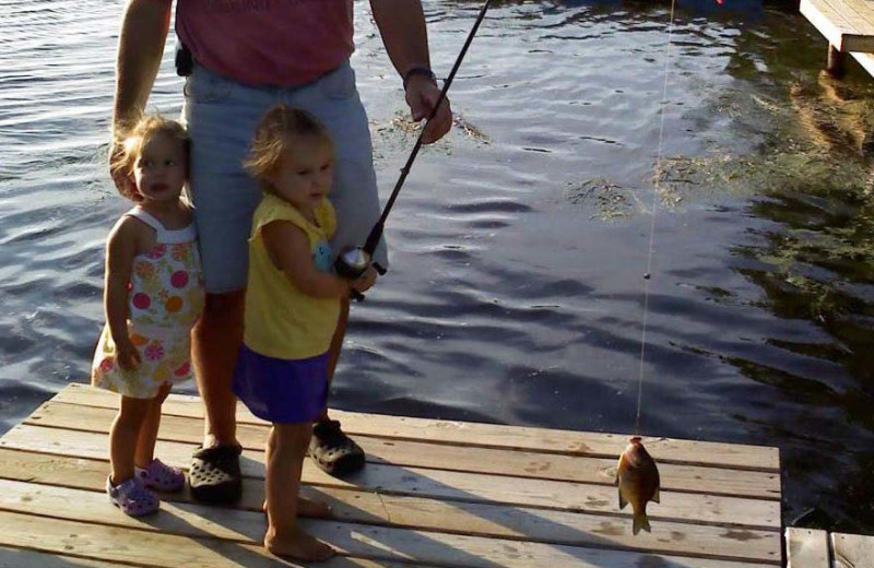 Family fishing at Ward's Riverside Cabins.