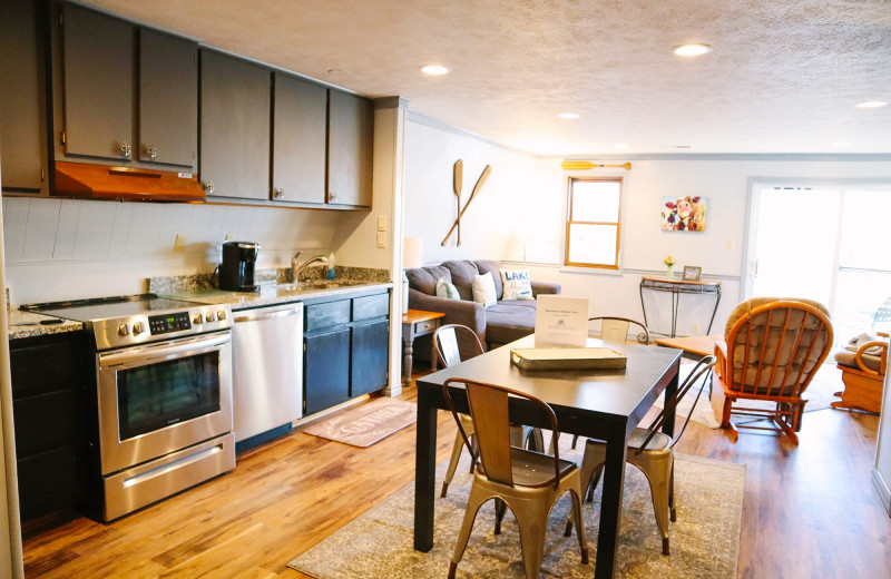 Rental kitchen and living room at Amazing Branson Cabin Rentals - RentBranson.