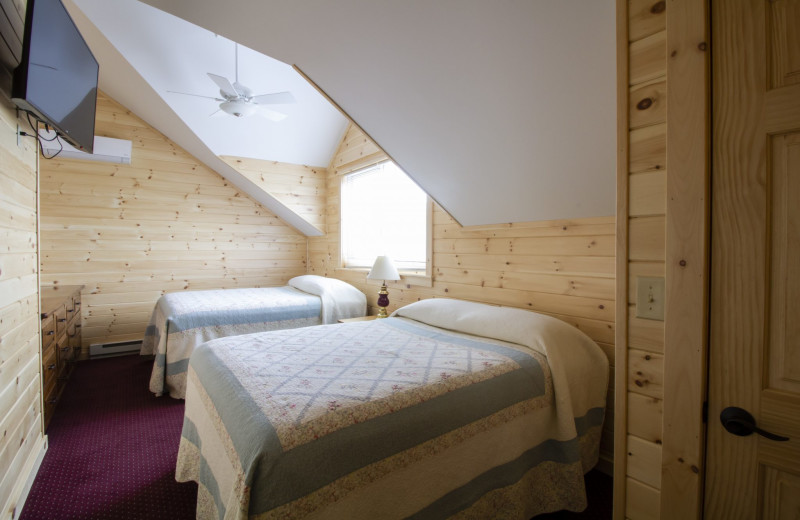 Cabin bedroom at Trout House Village Resort.