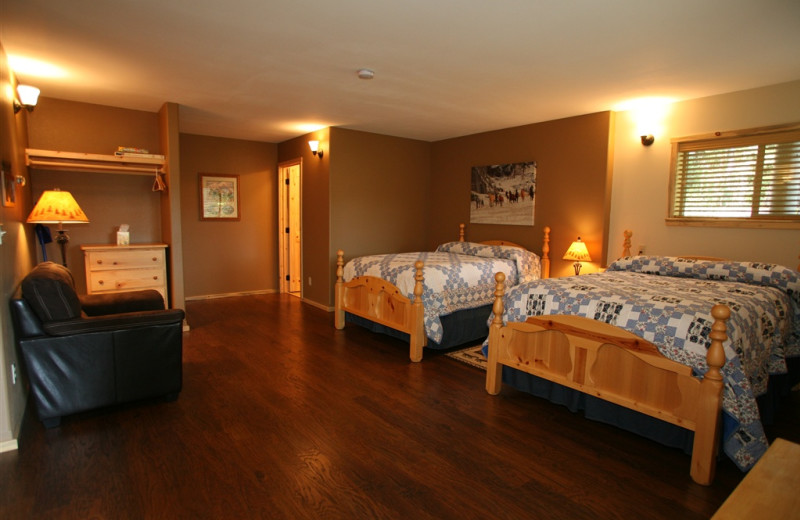 Cabin bedroom at Western Pleasure Guest Ranch.