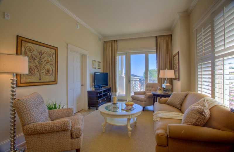 Living room with balcony at Sea Gate Inn.