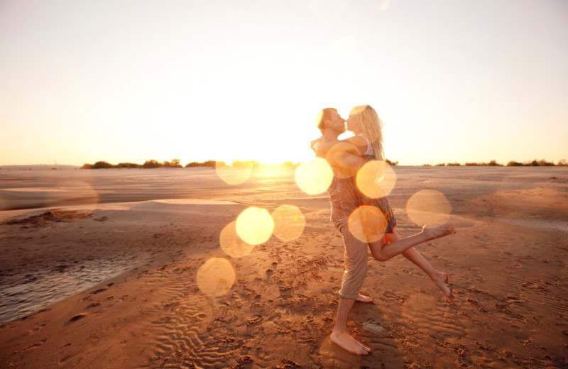 Couple on beach at Oakwood Resort.