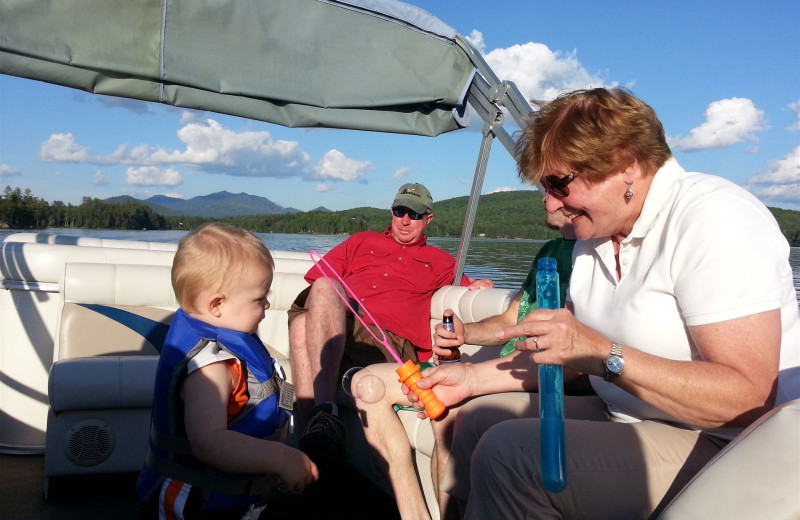 Family pontoon ride at Ampersand Bay Resort