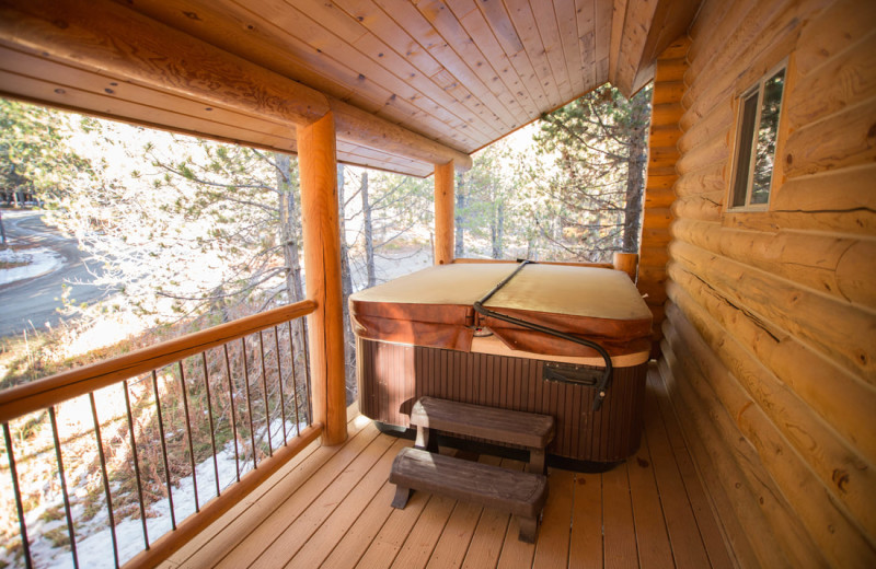 Cabin hot tub at The Pines at Island Park.