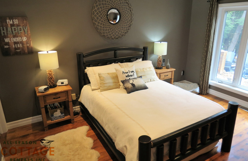 Rental bedroom at All-Season Cottage Rentals.