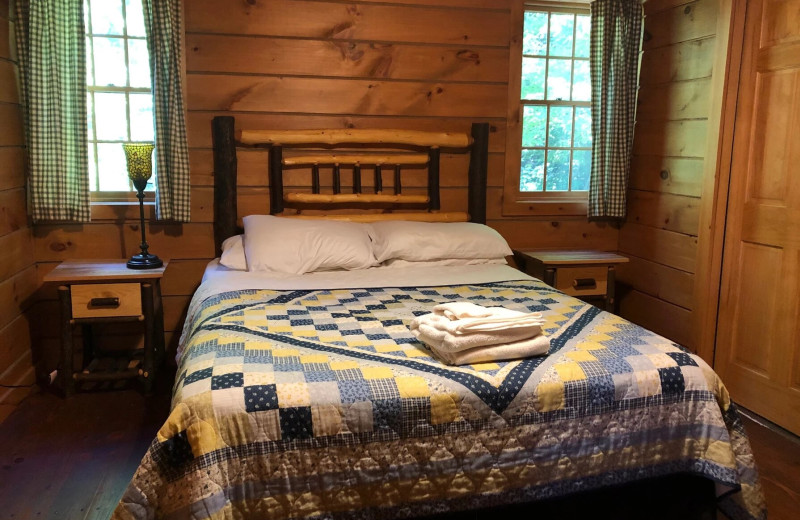 Cabin bedroom at Riverbay Adventure Inn.