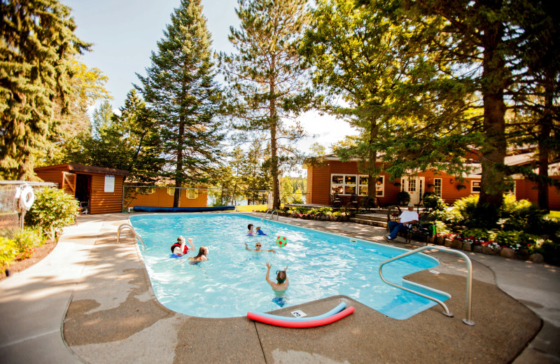 Many guests enjoy the outdoor heated pool at Half Moon Trail Resort. It is surrounded by gardens and is steps away from a hand dipped malt in the classic lodge. 