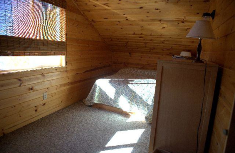 Cabin bedroom at Chase's Ethel Beach Resort.