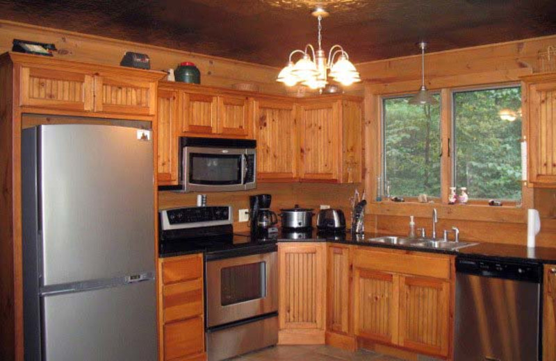 Cabin kitchen at Black Bear Cabin Rentals.