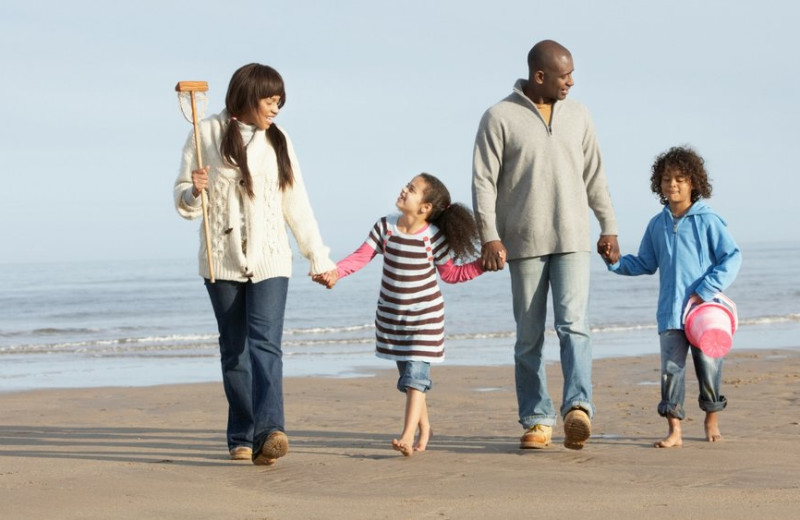 Family on beach at Icona Golden Inn.
