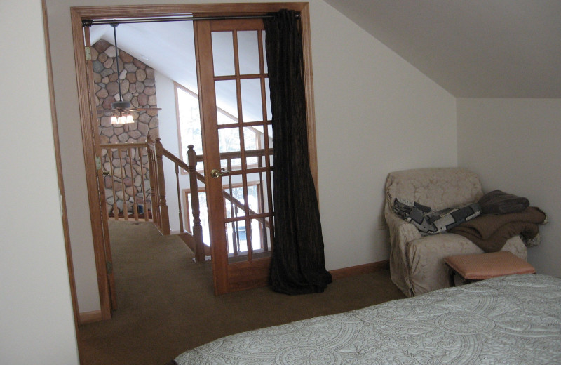 Cabin bedroom at Northwoods Vacation Rentals.