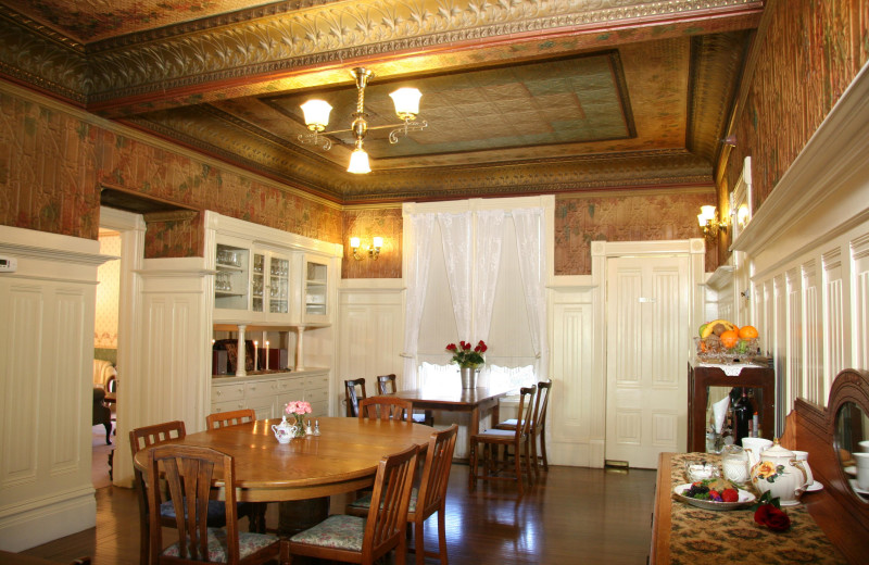 Dining Room with hand painted stamped tin ceiling Hennessey House Bed & Breakfast.