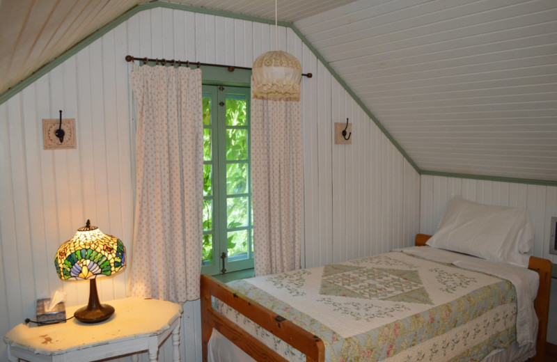 Cabin bedroom at Mulberry Mountain Lodging & Events.