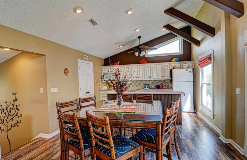 Vacation rental dining room at Century 21 Action Inc.