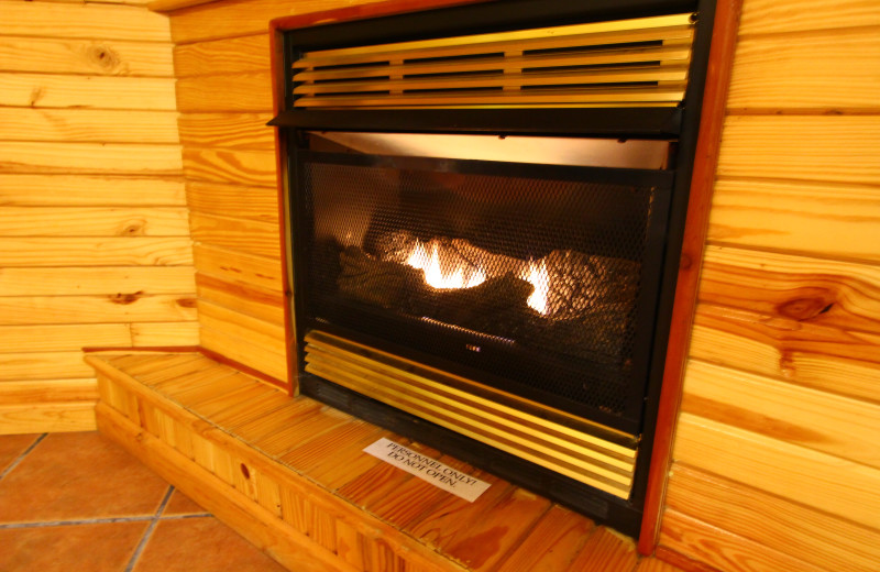 Relax by your cabin fireplace at Ozark Cabins.