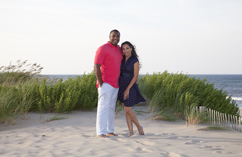 Couple on the beach at Oasis Suites.