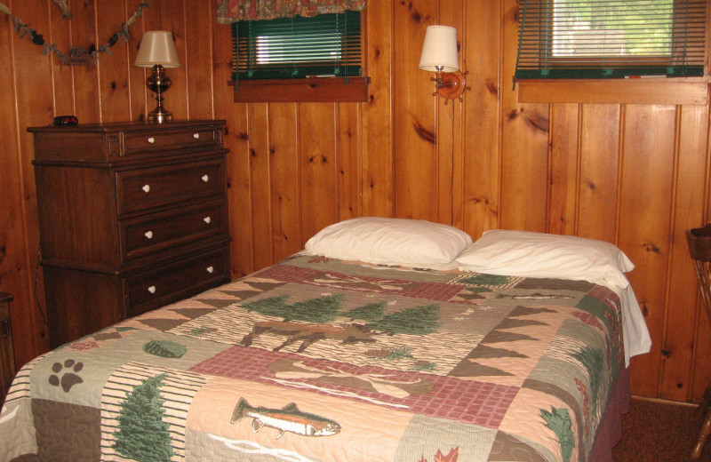 Cabin bedroom at Northwoods Vacation Rentals.