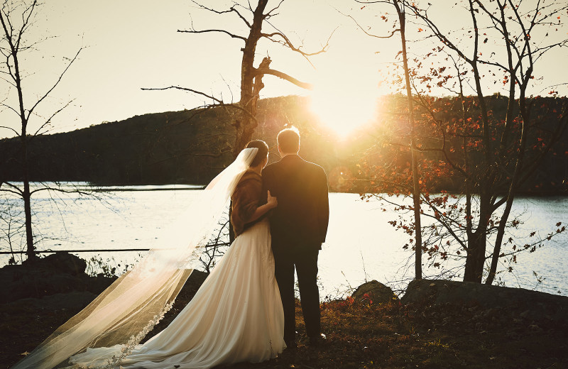 Couple by lake at Arrow Park Lake and Lodge.