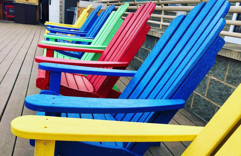 Adirondack chairs at Surfside on the Lake Hotel & Suites.