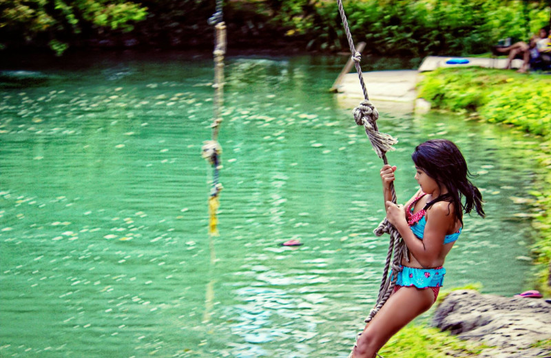 Swinging on rope at Geronimo Creek Retreat.