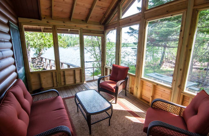 Cabin porch at Clearwater Historic Lodge and Canoe Outfitters.