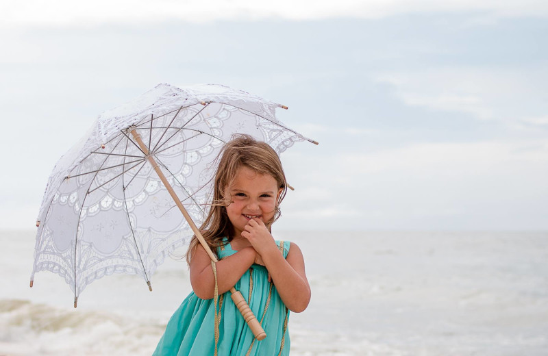 Child on beach at Sunset Properties.