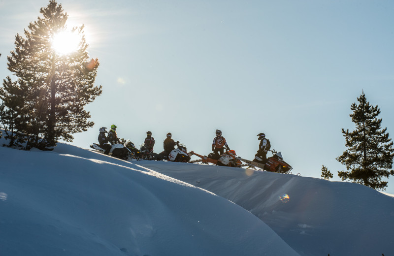 Snowmobiling at Wild Skies Cabin Rentals.