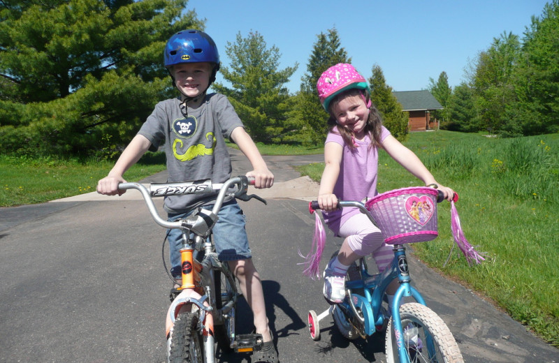 Kids biking at Woodside Cottages of Bayfield.