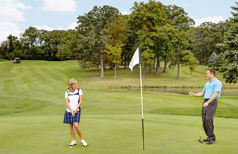 Playing golf at Eaglewood Resort & Spa.